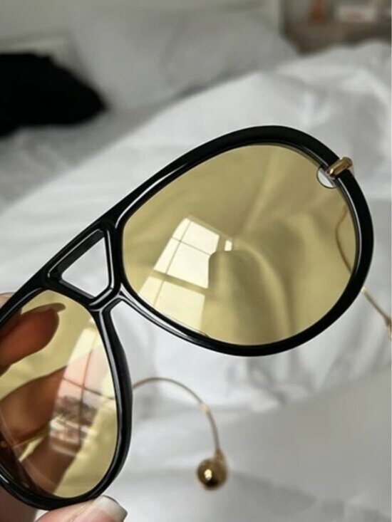 Bottega Veneta Black and Gold Sunglasses.